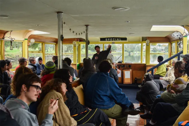 Nicholas Burridge speaking to a captive audience on board the Tramboat